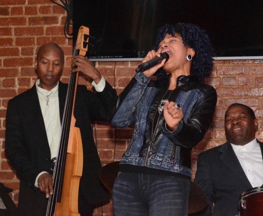 Stacia Hobdy performing live with her band
