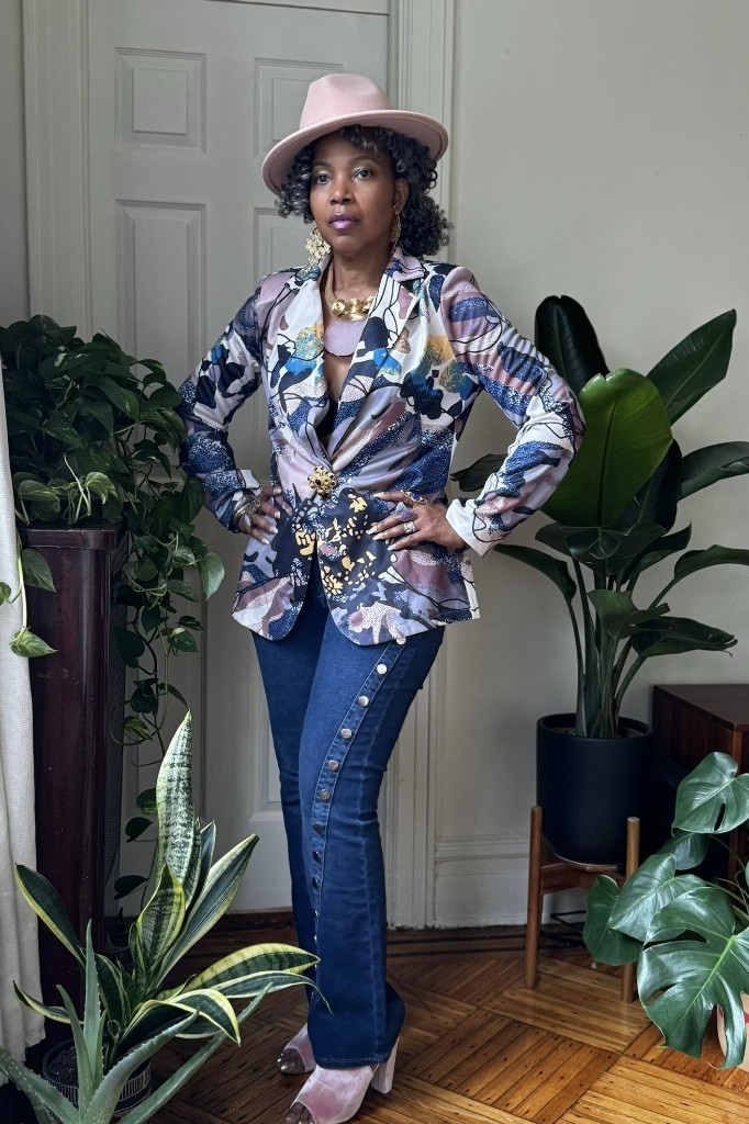 Stacia Hobdy in a pink hat and floral blazer